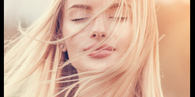 blong woman eyes closed thinking about sobriety